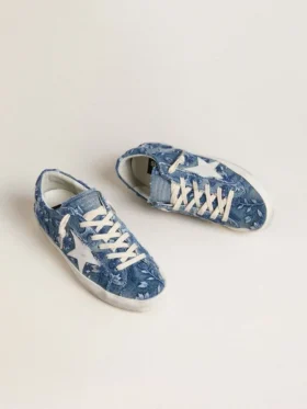 Women’s Super-Star LTD in light blue denim with a white leather star and embroidered flowers