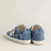 Women's Super-Star LTD in light blue denim with a white leather star and embroidered flowers