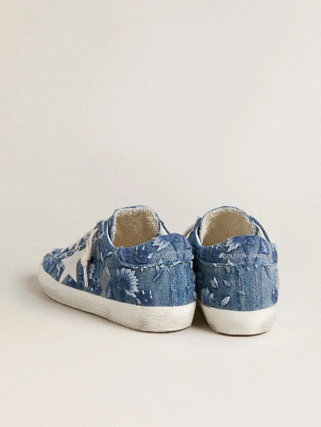 Women's Super-Star LTD in light blue denim with a white leather star and embroidered flowers