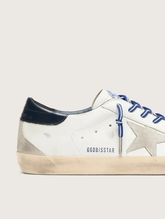 Women’s Super-Star LTD in white leather with suede star and blue leather heel tab
