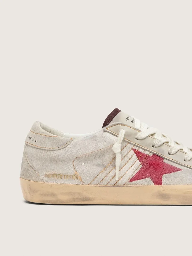 Women’s Super-Star LTD in white pony skin with red suede star