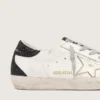 Women's Super-Star with gold star and black glitter heel tab