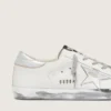 Women's Super-Star with silver sparkle foxing and metal stud lettering