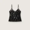 Women's top in black tulle with floral pattern in black sequins