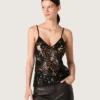 Women's top in black tulle with floral pattern in black sequins