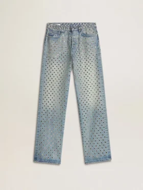 Women's washed jeans with all-over eyelets