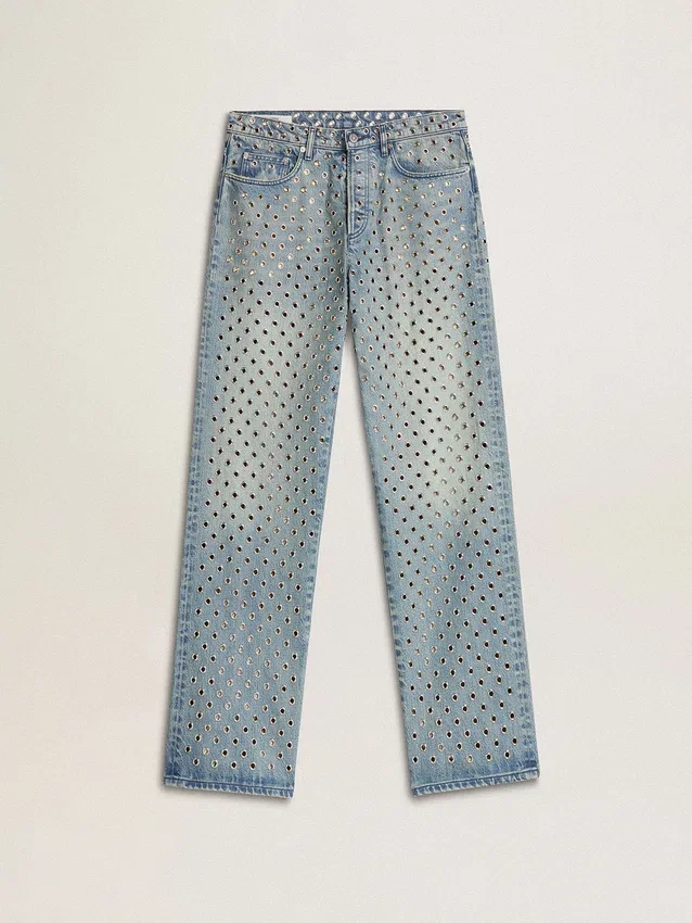 Women's washed jeans with all-over eyelets