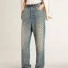 Women's washed jeans with all-over eyelets