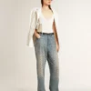 Women's washed jeans with all-over eyelets