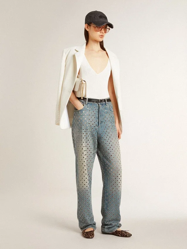 Women's washed jeans with all-over eyelets
