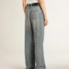 Women's washed jeans with all-over eyelets