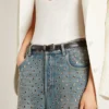 Women's washed jeans with all-over eyelets