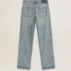Women's washed jeans with all-over eyelets