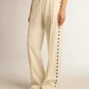 Women’s white joggers with stars on the sides