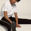 Women's white T-shirt with silver glitter logo and star
