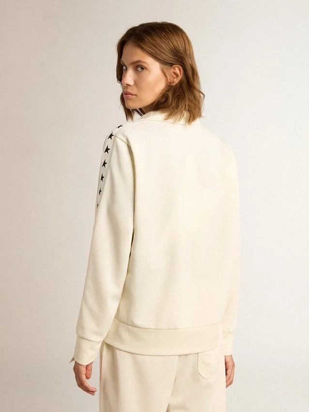 Women’s white zipped sweatshirt with white strip and black stars