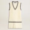 Women's worn-white cotton vest dress with dark blue ribbing and crystals