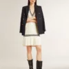 Women's worn-white cotton vest dress with dark blue ribbing and crystals