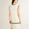 Women's worn-white cotton vest dress with dark blue ribbing and crystals