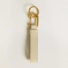 Worn white keyring