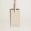 Worn white luggage tag