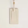 Worn white luggage tag