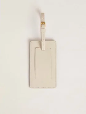 Worn white luggage tag