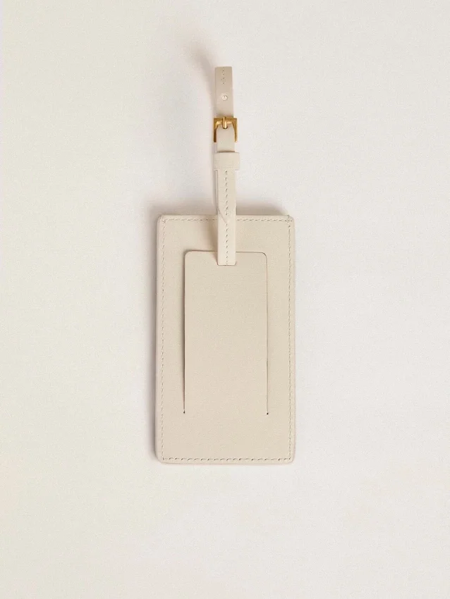 Worn white luggage tag
