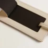 Worn white luggage tag