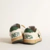 Young Ball Star in white leather with green suede star